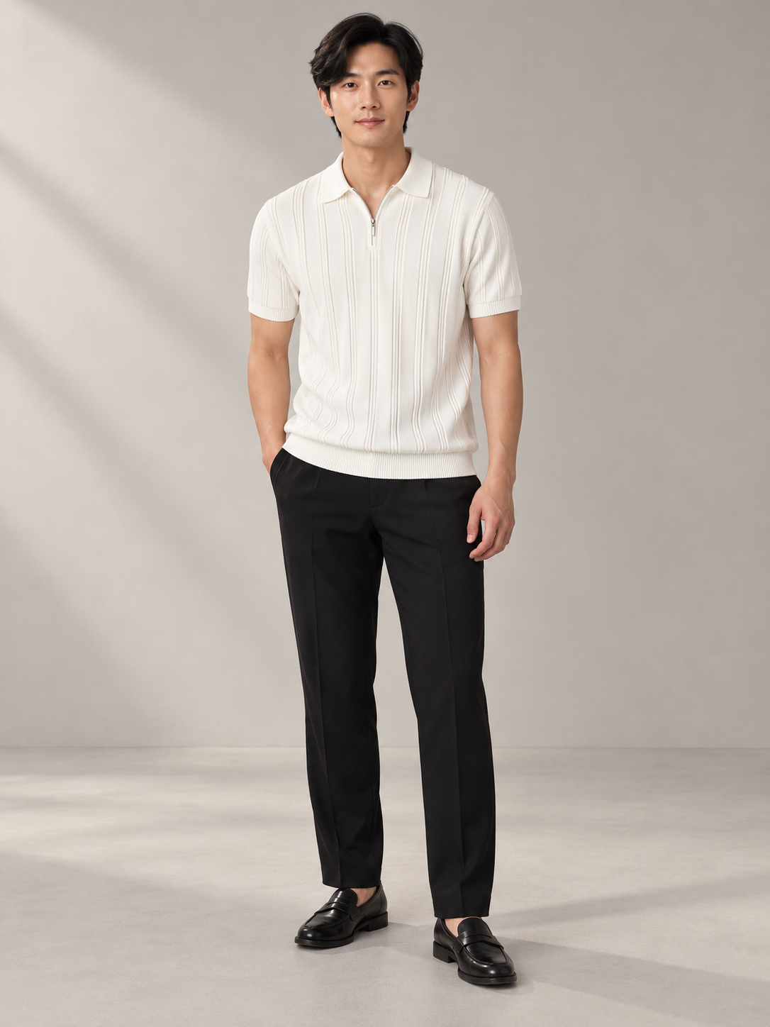 Full-body model wearing ZOÆ's white textured zip polo.